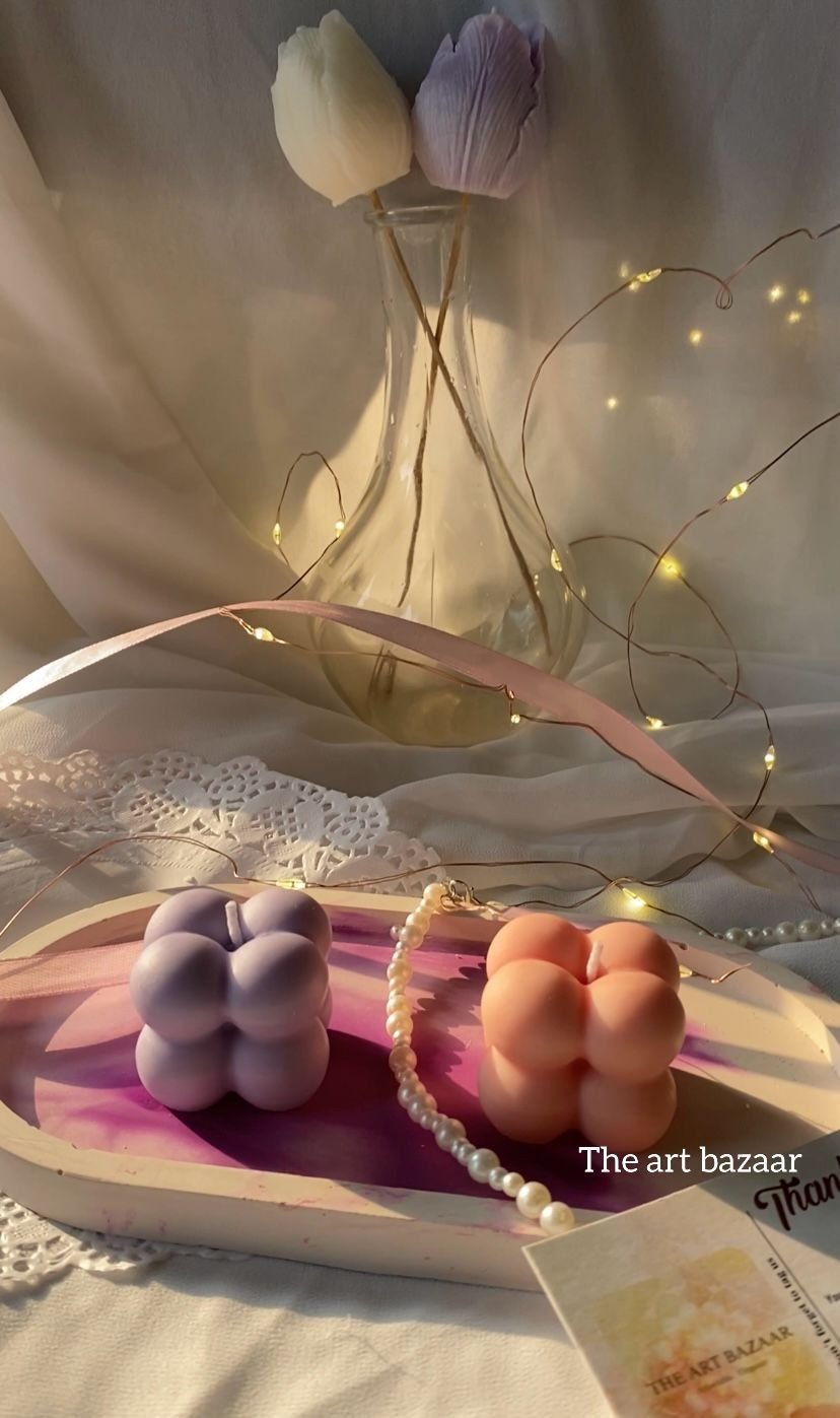 Bubble candles arranged with a ribbon and a brand card