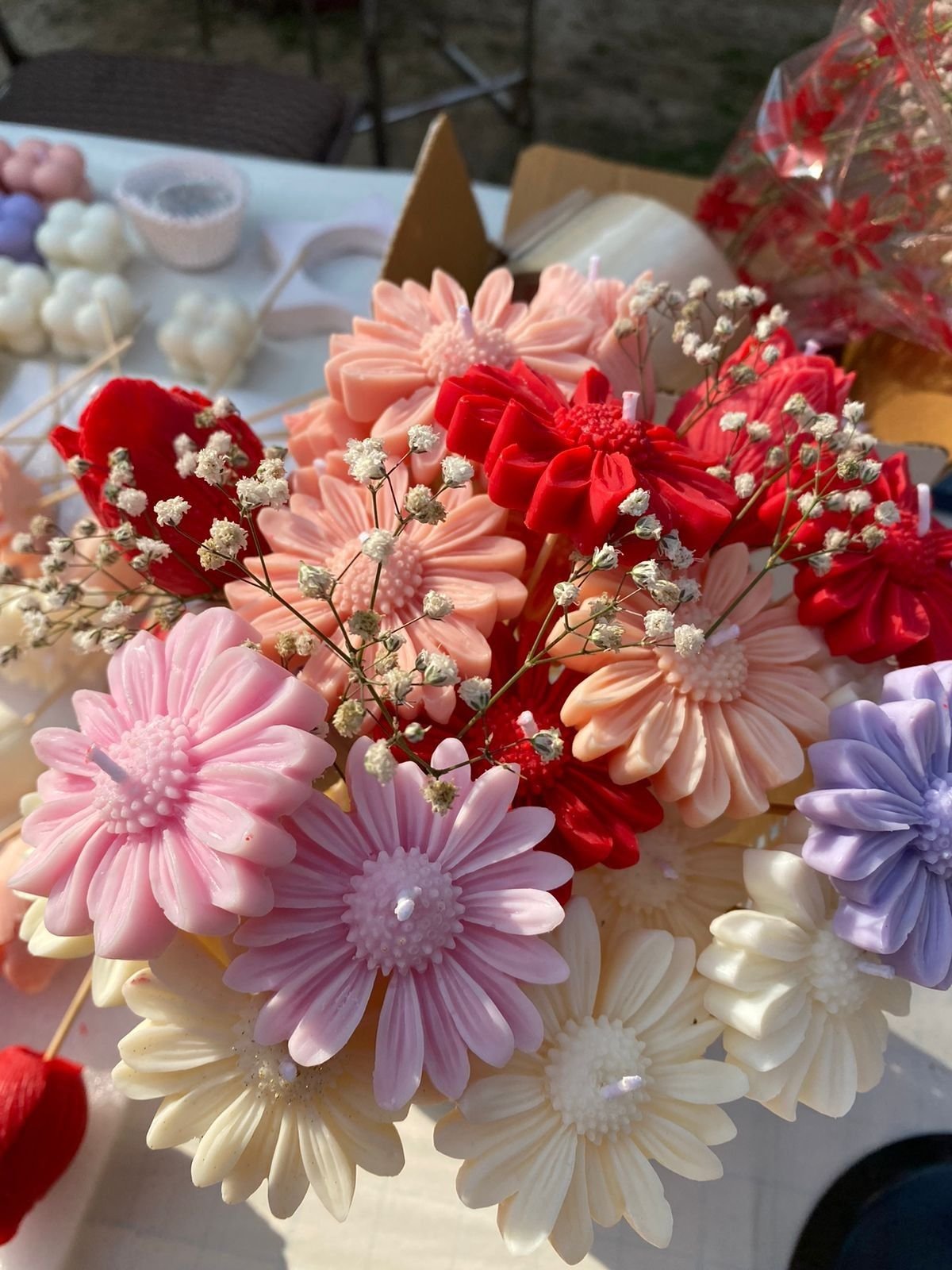 The same bouquet seen closer, showing the pearl centres of the daisies
