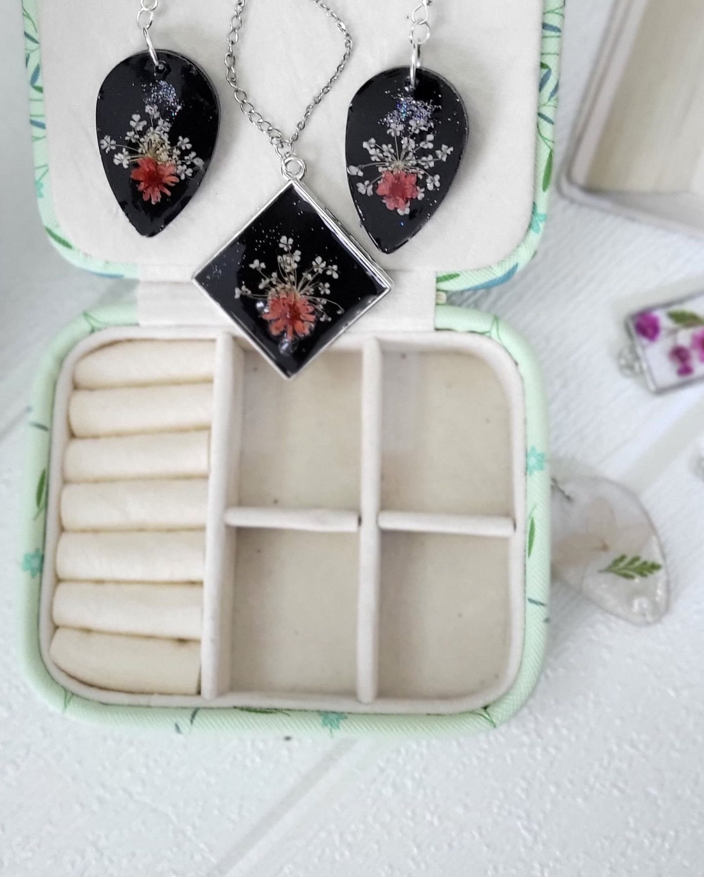 The two small clear pendants side by side